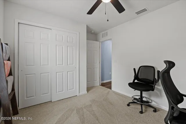 a view of a workspace with furniture