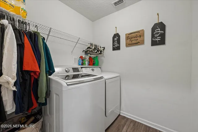 a utility room with dryer and washer