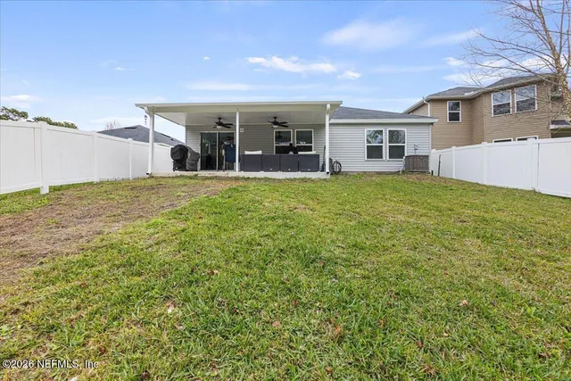 a view of a house with backyard porch and garden
