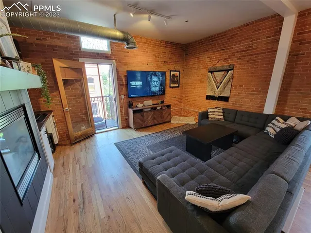 a living room with furniture and a flat screen tv