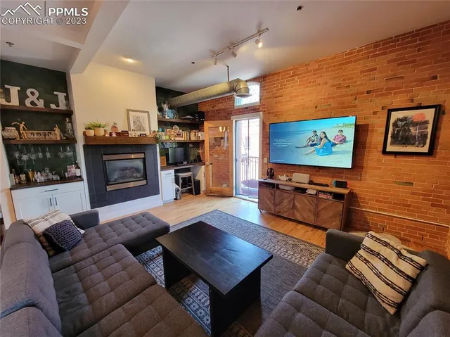 a living room with furniture and a flat screen tv