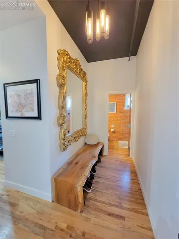 a room with wooden floor and staircase