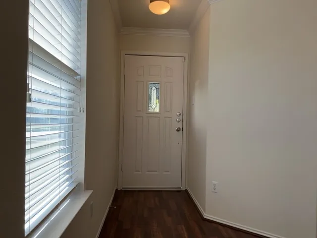 a view of a room that has a window in it