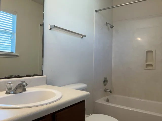 a bathroom with a sink and a bathtub