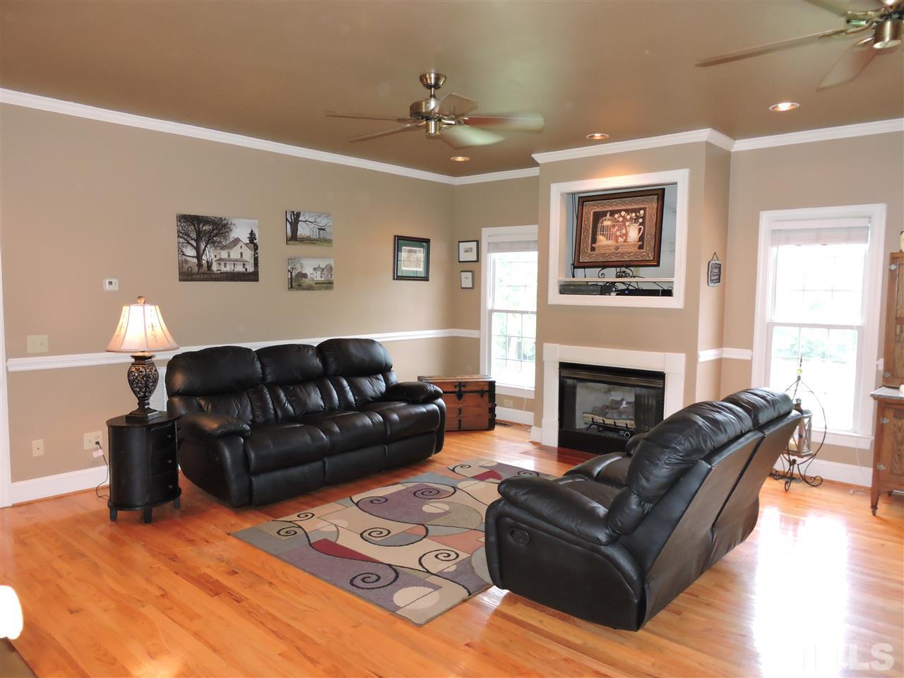 1409 Mill Hill Road Roxboro, NC 27574 - Photo 3 of 25 a living room with furniture and a fireplace