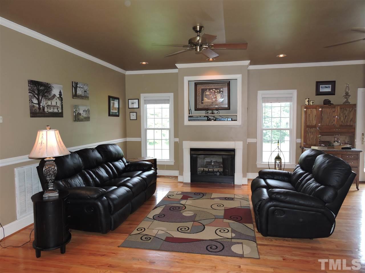 1409 Mill Hill Road Roxboro, NC 27574 - Photo 8 of 25 a living room with furniture and a fireplace