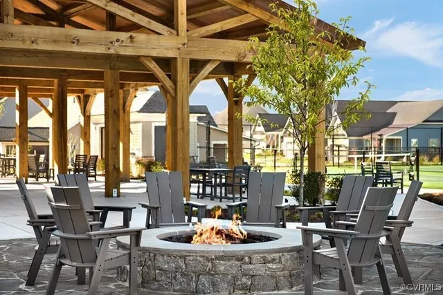 a living room filled with furniture and a potted plant