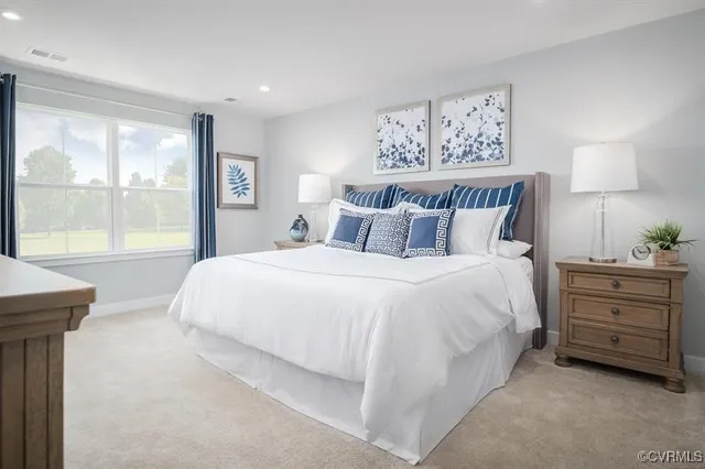 a bedroom with a bed and a night stand