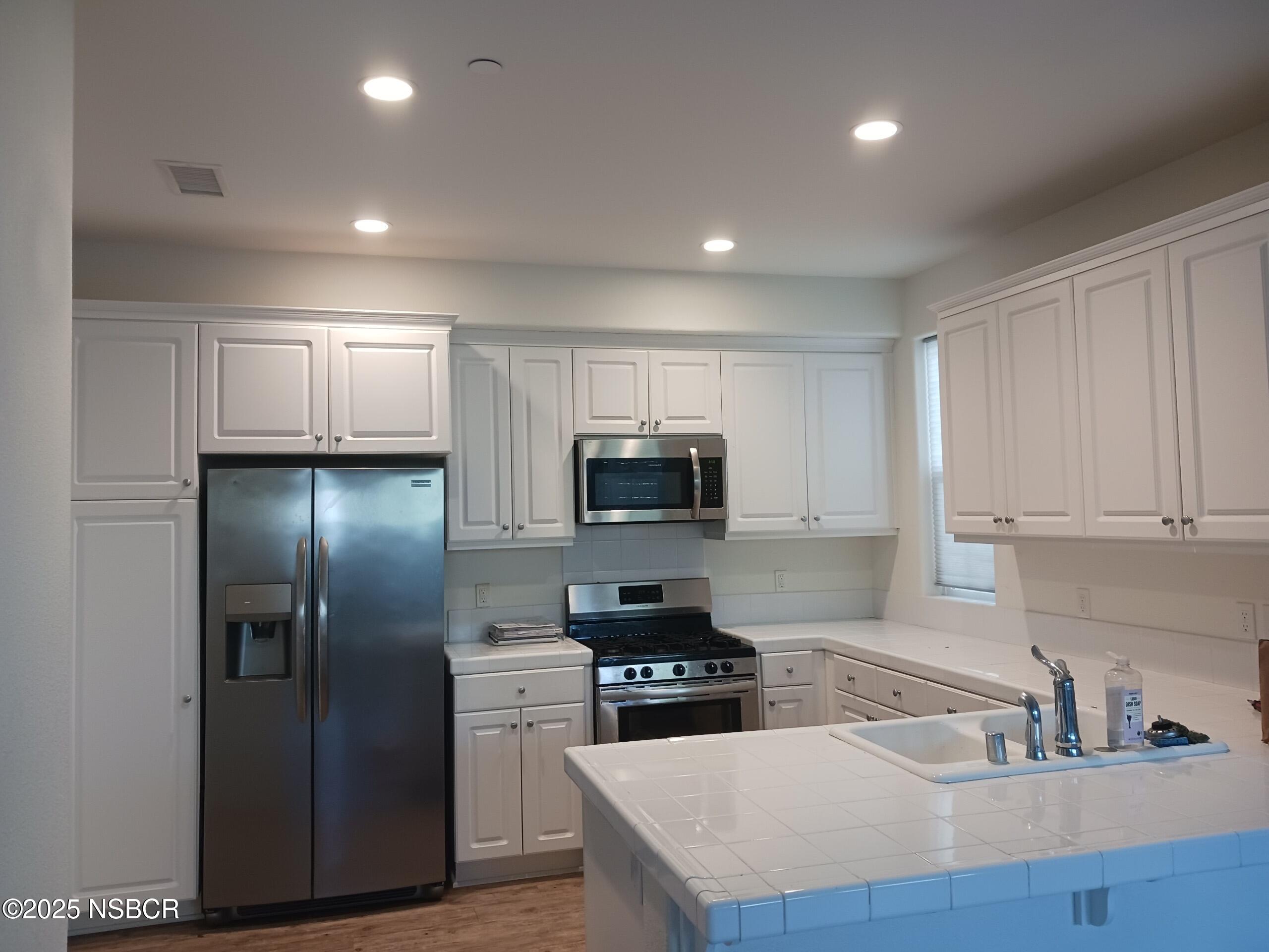 Undisclosed Address Buellton, CA 93427 - Photo 1 of 12 a kitchen with kitchen island a counter space a sink and stainless steel appliances