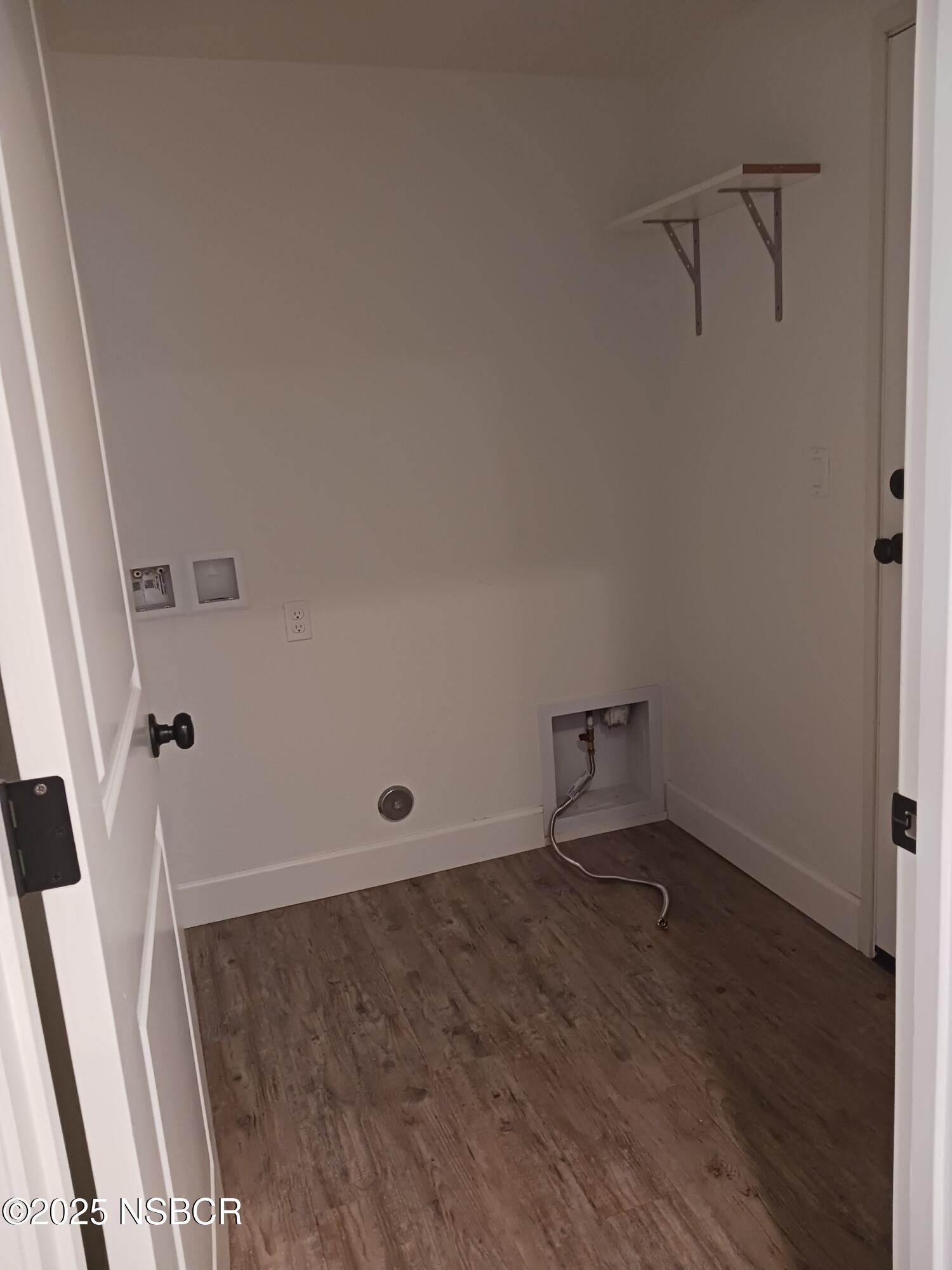 Undisclosed Address Buellton, CA 93427 - Photo 11 of 12 an empty room with wooden floor and windows