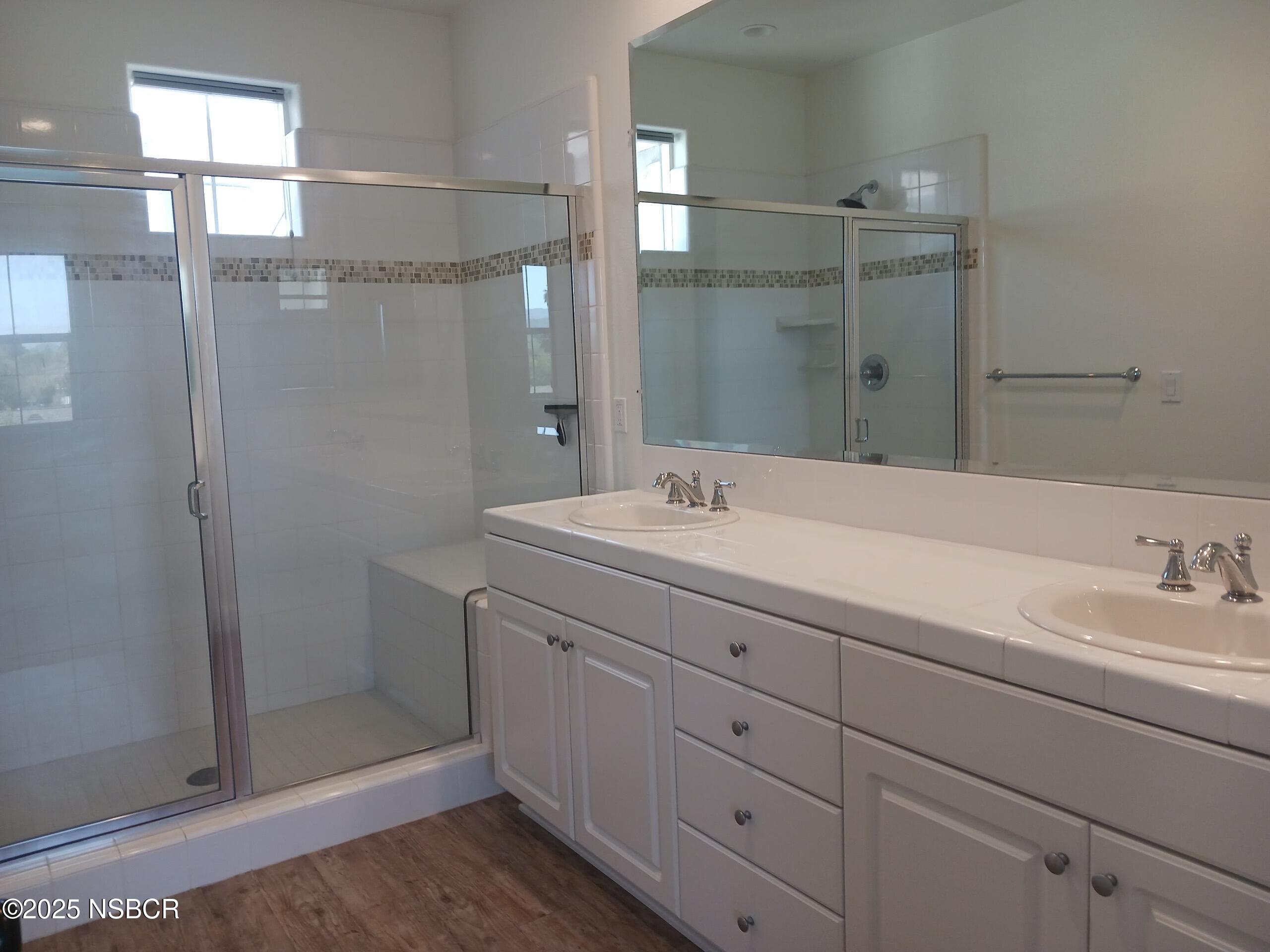 Undisclosed Address Buellton, CA 93427 - Photo 6 of 12 a bathroom with a shower sink and mirror