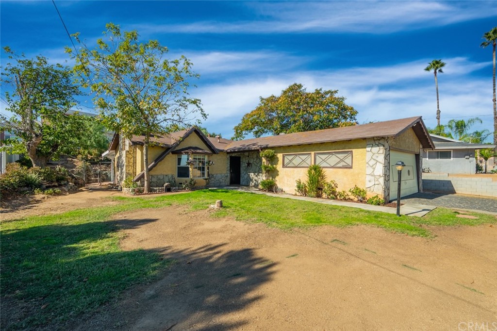 6592 Valley Drive Riverside, CA 92505 - Photo 1 of 1 a front view of a house with a yard and garage