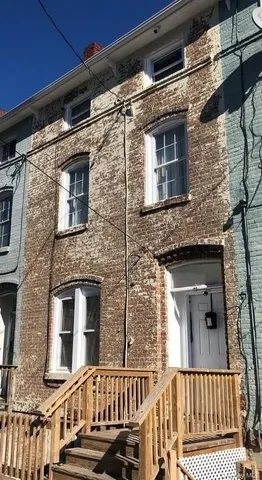 a view of a brick house with a window