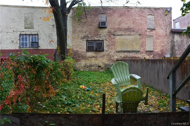 a view of a porch with furniture and a fire pit