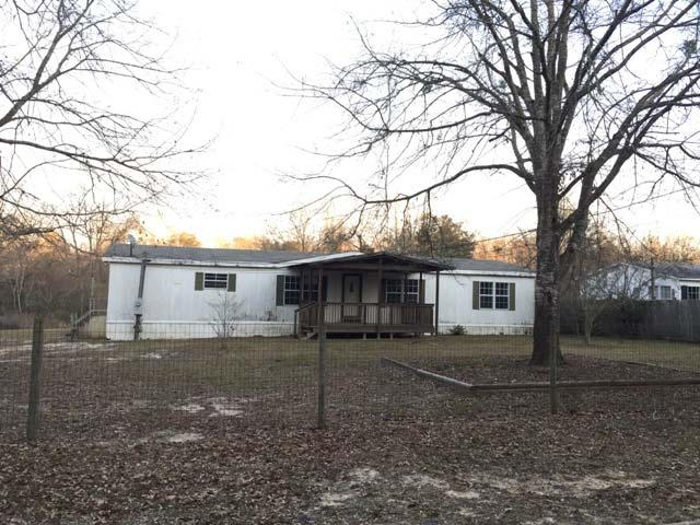 1948 Parker Road Cantonment, FL 32533 - Photo 1 of 28 a view of a house with a yard