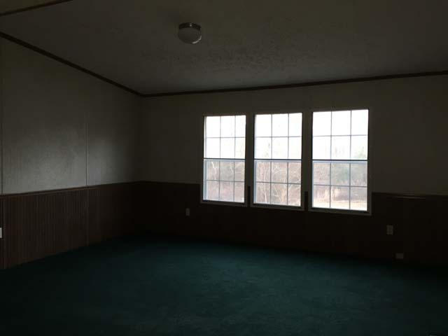 1948 Parker Road Cantonment, FL 32533 - Photo 17 of 28 a view of an empty room with a window