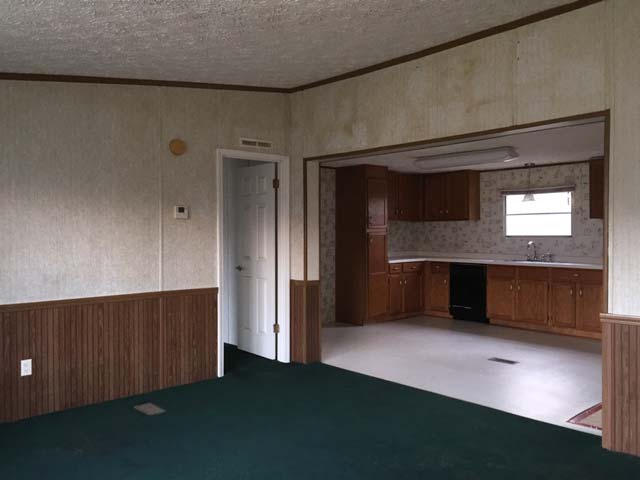1948 Parker Road Cantonment, FL 32533 - Photo 18 of 28 a kitchen with kitchen island sink and refrigerator