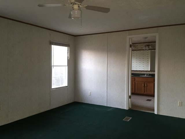 1948 Parker Road Cantonment, FL 32533 - Photo 19 of 28 an empty room with windows and closet