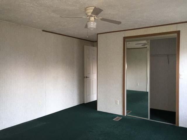 1948 Parker Road Cantonment, FL 32533 - Photo 20 of 28 an empty room with a ceiling fan and a window
