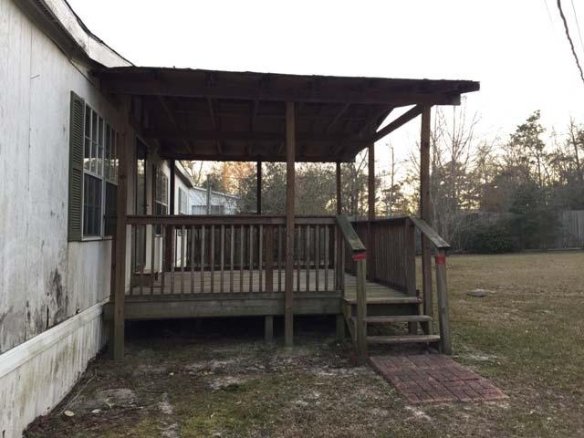 1948 Parker Road Cantonment, FL 32533 - Photo 3 of 28 a view of a bench in the backyard
