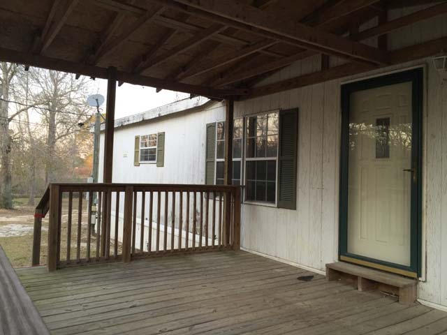 1948 Parker Road Cantonment, FL 32533 - Photo 5 of 28 a view of a porch with wooden floor and stairs