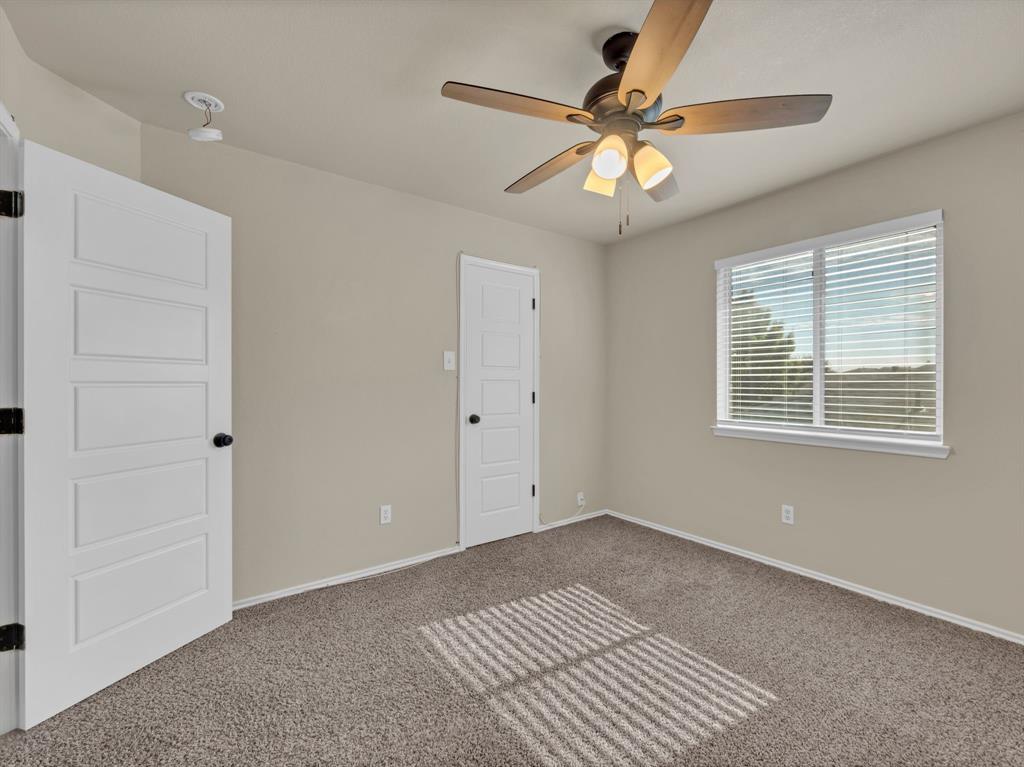 2917 Mayfair Lane Lancaster, TX 75134 - Photo 26 of 40 Spare room with carpet and ceiling fan