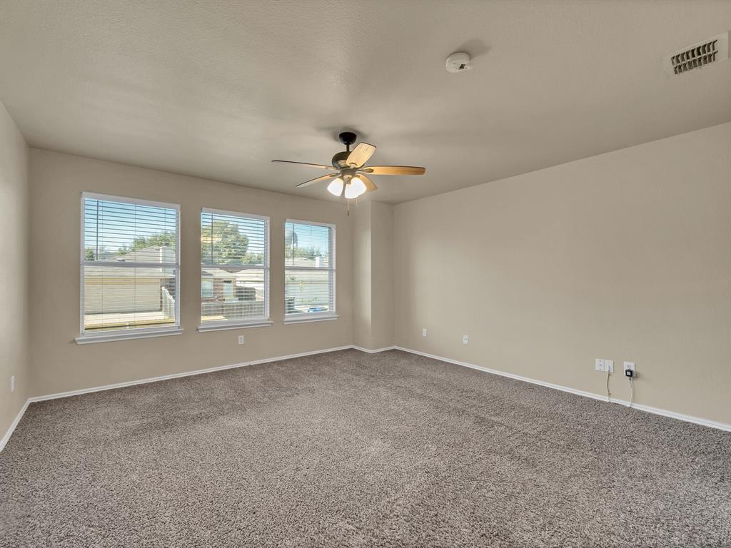 2917 Mayfair Lane Lancaster, TX 75134 - Photo 27 of 40 Unfurnished room with carpet floors and ceiling fan