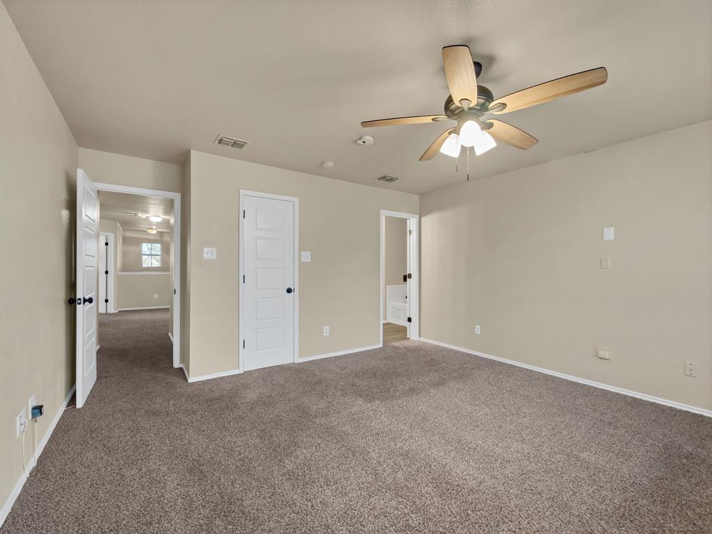 2917 Mayfair Lane Lancaster, TX 75134 - Photo 28 of 40 Unfurnished bedroom with carpet flooring and ceiling fan