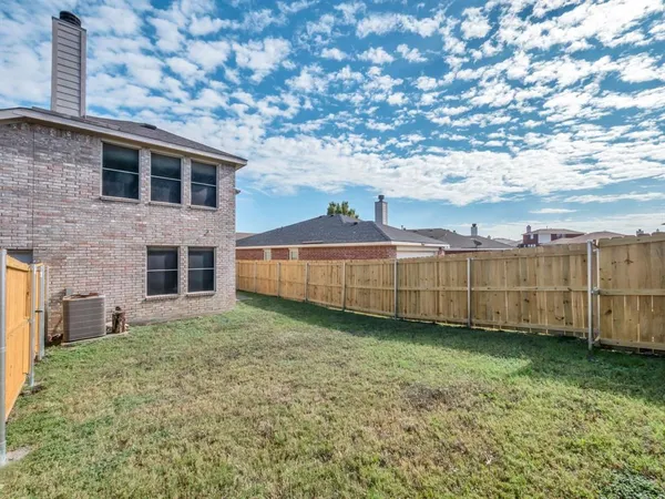 a view of a backyard of the house