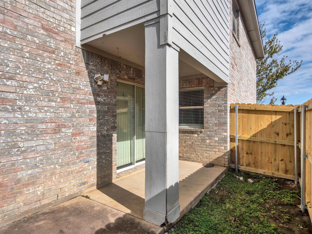 2917 Mayfair Lane Lancaster, TX 75134 - Photo 40 of 40 Property entrance with brick siding and a patio