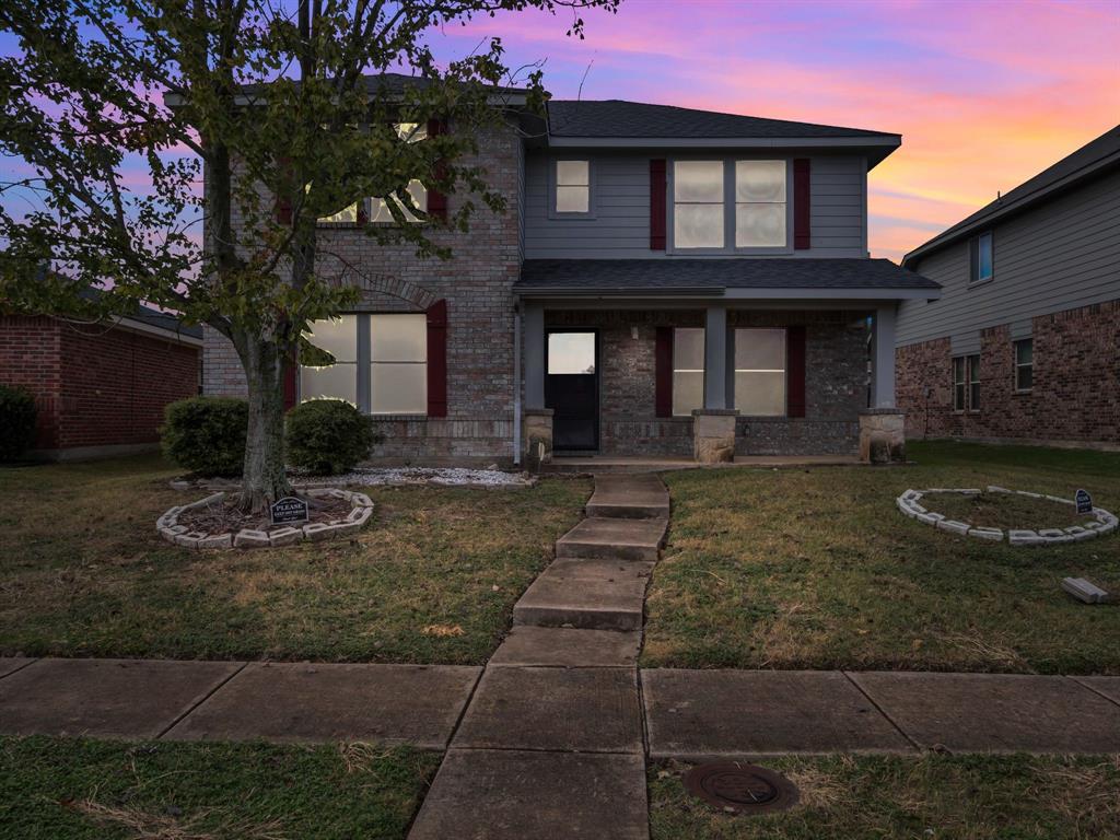 2917 Mayfair Lane Lancaster, TX 75134 - Photo 5 of 40 Traditional home featuring covered porch, a front yard, brick siding, and roof with shingles