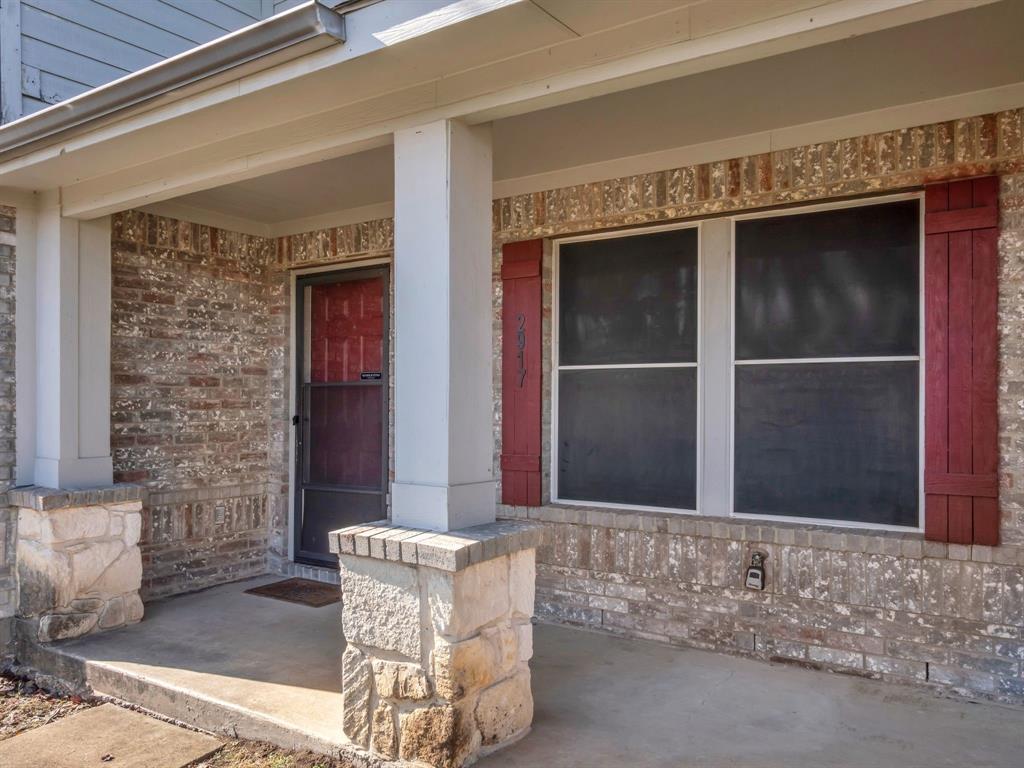 2917 Mayfair Lane Lancaster, TX 75134 - Photo 10 of 40 Doorway to property with covered porch and brick siding