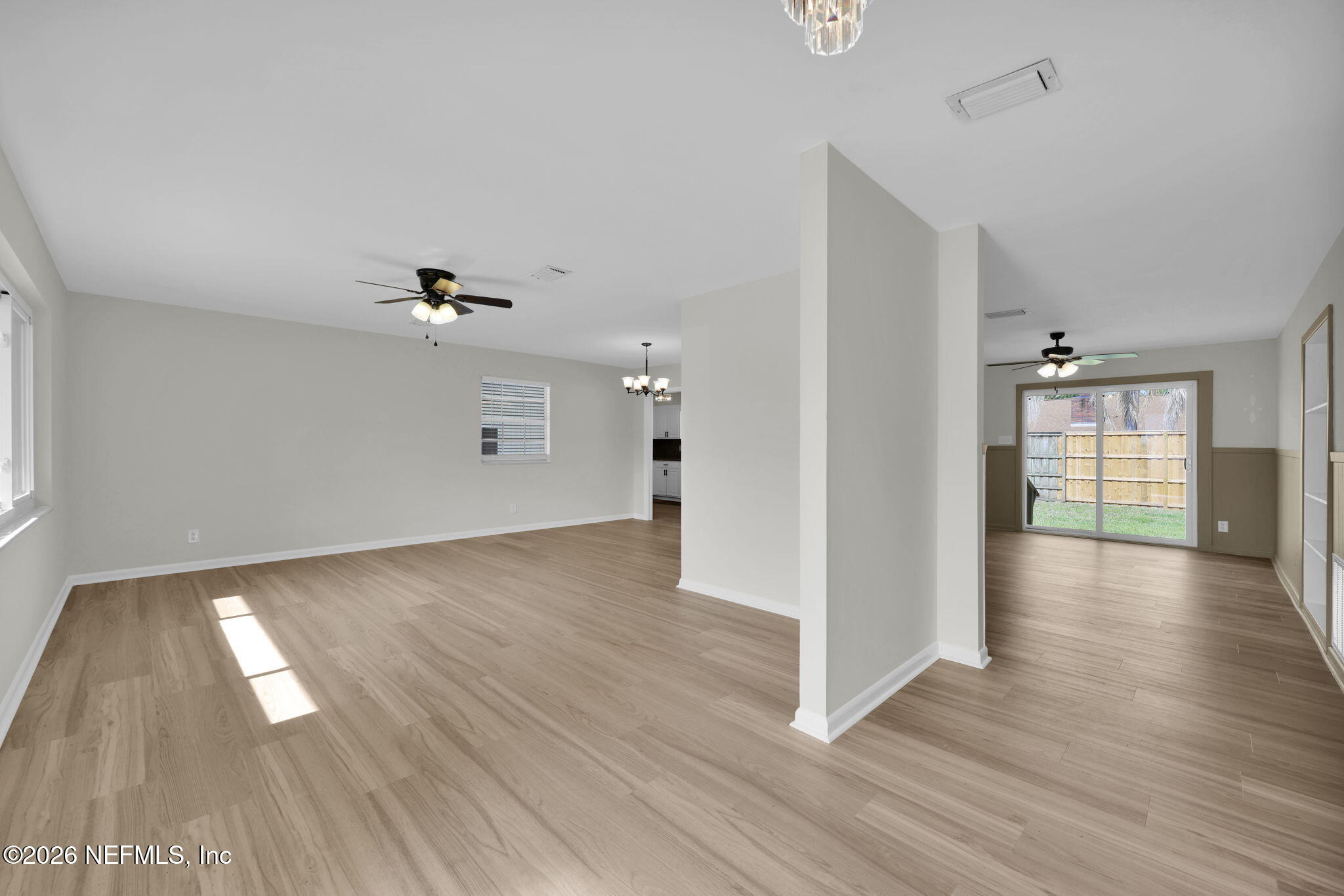8544 Sanchez Road Jacksonville, FL 32217 - Photo 9 of 46 wooden floor in an empty room with a window
