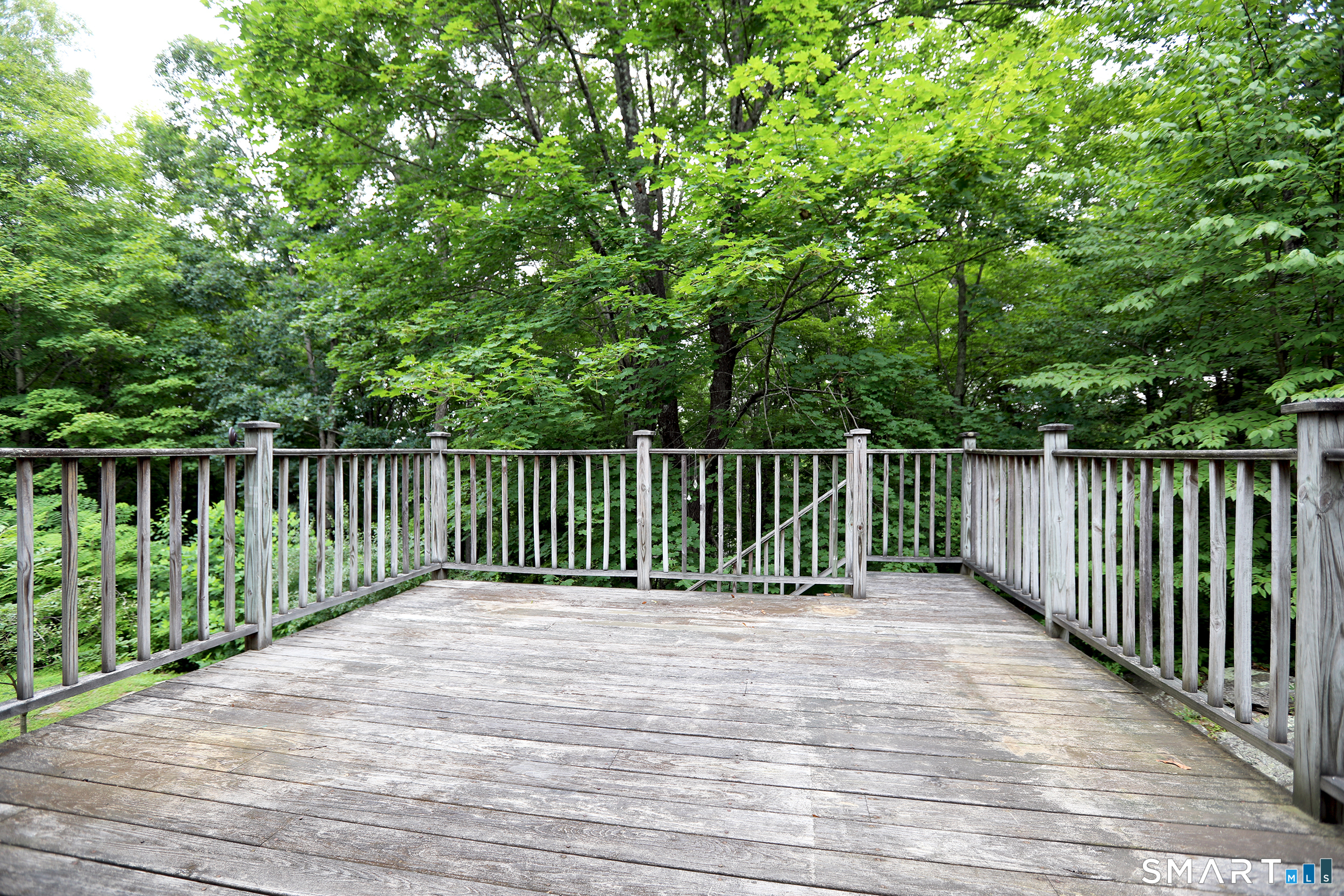 42 Straits Road Chester, CT 06412 - Photo 10 of 24 The deck is located through sliders off of the Living Room
