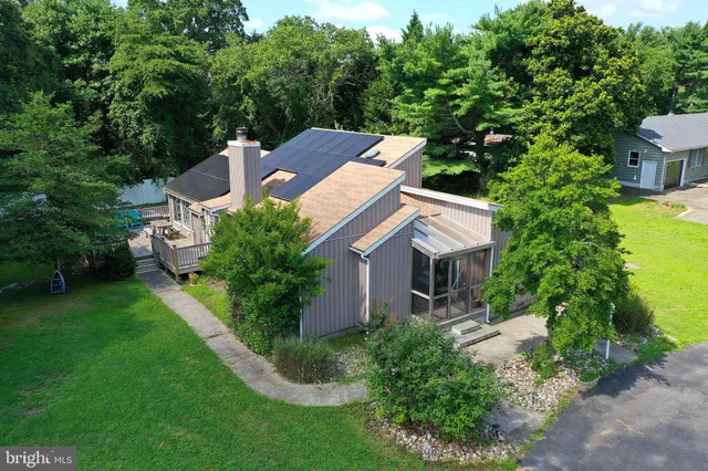 an aerial view of a house with a garden