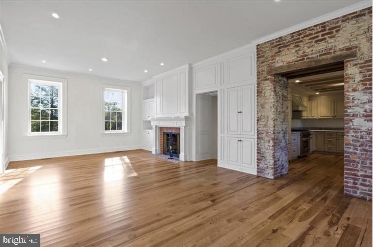 16131 Old York Road Monkton, MD 21111 - Photo 11 of 31 a view of empty room with wooden floor and fireplace