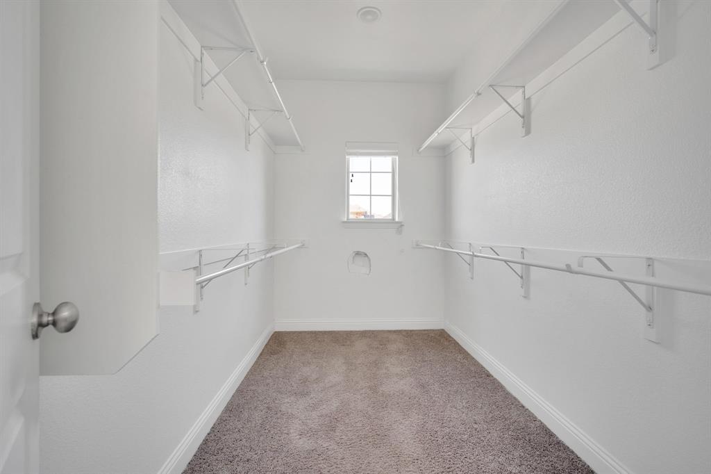 117 Melody Way Red Oak, TX 75154 - Photo 22 of 40 Walk in closet featuring light carpet