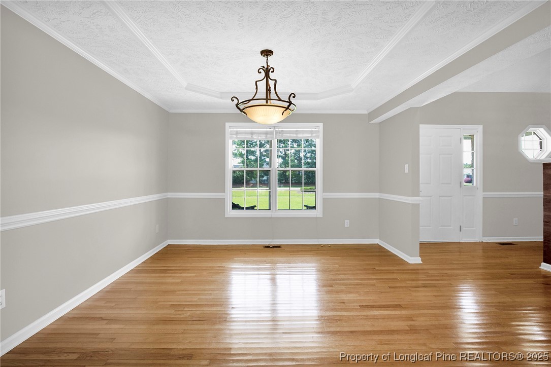 995 Adcox Road Raeford, NC 28376 - Photo 12 of 50 a view of empty room with wooden floor and fan