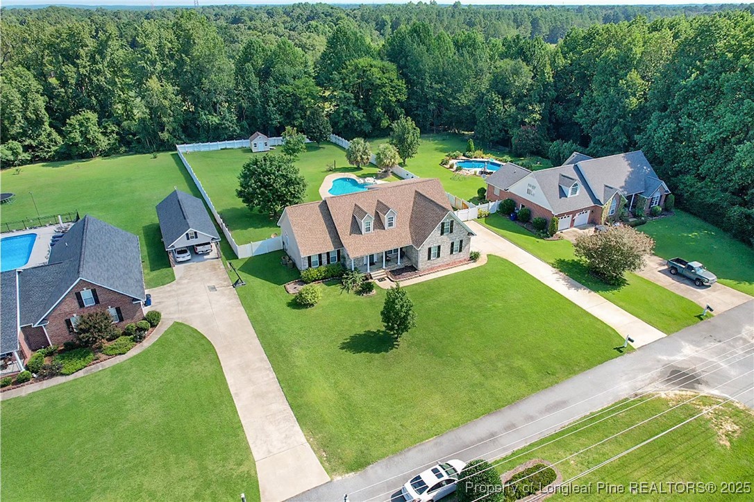 995 Adcox Road Raeford, NC 28376 - Photo 2 of 50 an aerial view of a house with garden space and street view