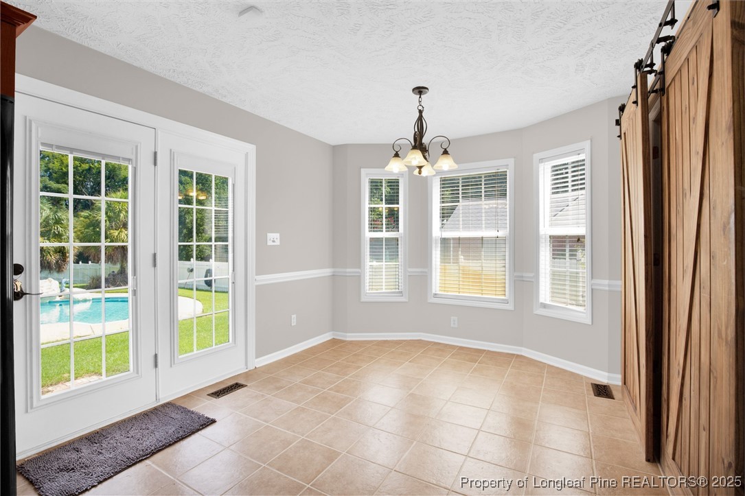 995 Adcox Road Raeford, NC 28376 - Photo 22 of 50 a view of an empty room with a window