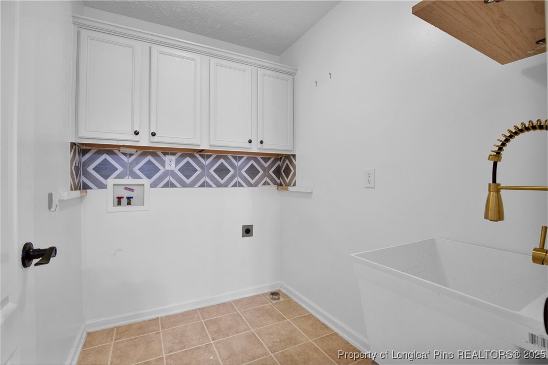 995 Adcox Road Raeford, NC 28376 - Photo 23 of 50 a bathroom with a bathtub