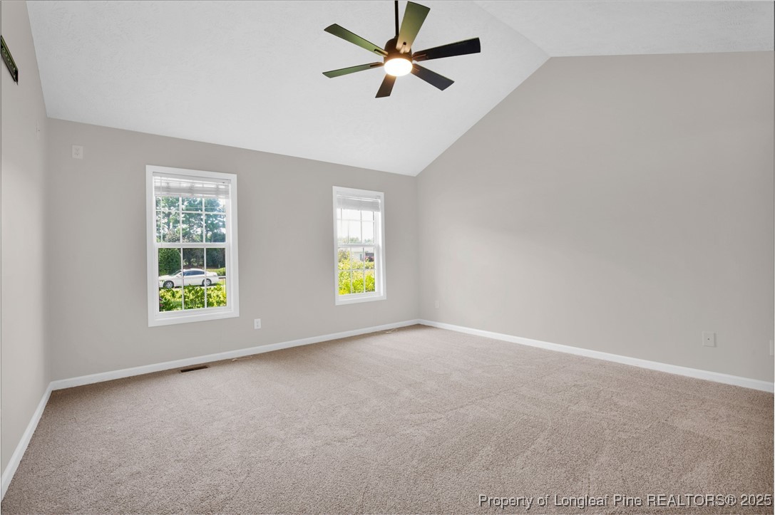995 Adcox Road Raeford, NC 28376 - Photo 25 of 50 an empty room with windows and fan