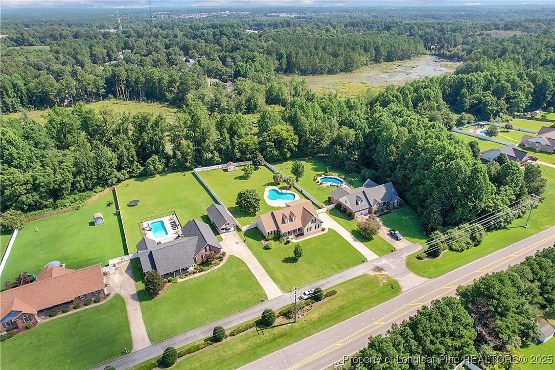 995 Adcox Road Raeford, NC 28376 - Photo 3 of 50 an aerial view of a house with a garden