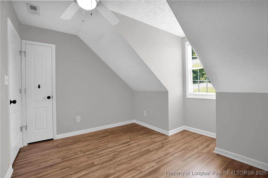 995 Adcox Road Raeford, NC 28376 - Photo 35 of 50 a view of an empty room with wooden floor and a window