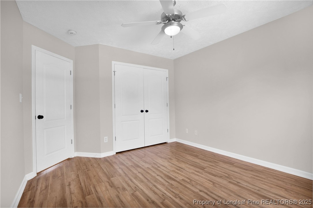 995 Adcox Road Raeford, NC 28376 - Photo 37 of 50 a view of a room with wooden floor and ceiling fan