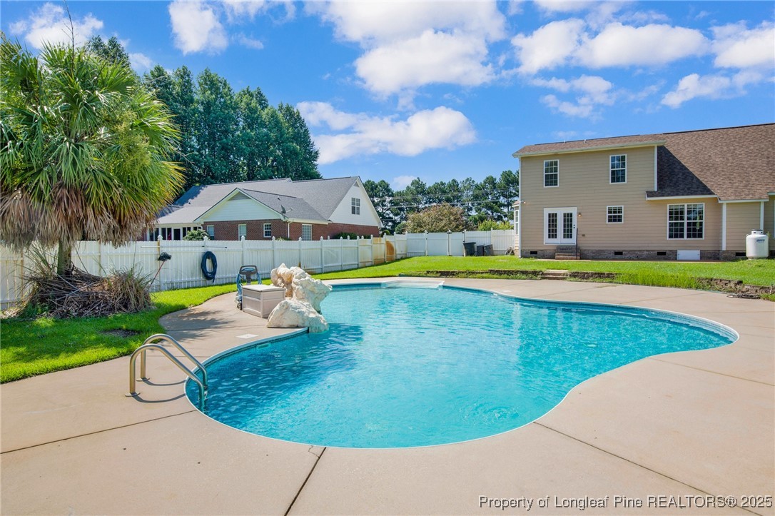 995 Adcox Road Raeford, NC 28376 - Photo 44 of 50 a view of a swimming pool with lounge chairs