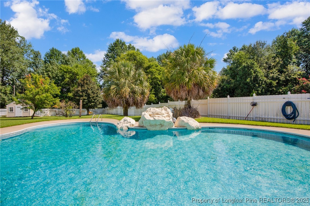 995 Adcox Road Raeford, NC 28376 - Photo 46 of 50 a view of swimming pool with lawn chairs and plants