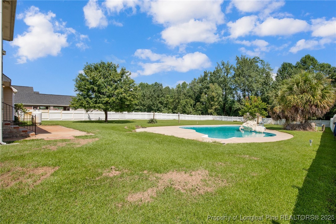 995 Adcox Road Raeford, NC 28376 - Photo 50 of 50 a view of a swimming pool with a yard