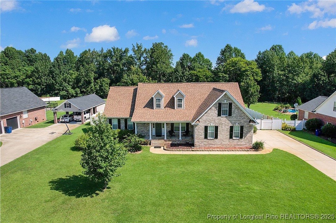 995 Adcox Road Raeford, NC 28376 - Photo 5 of 50 a view of a house with a backyard porch and sitting area