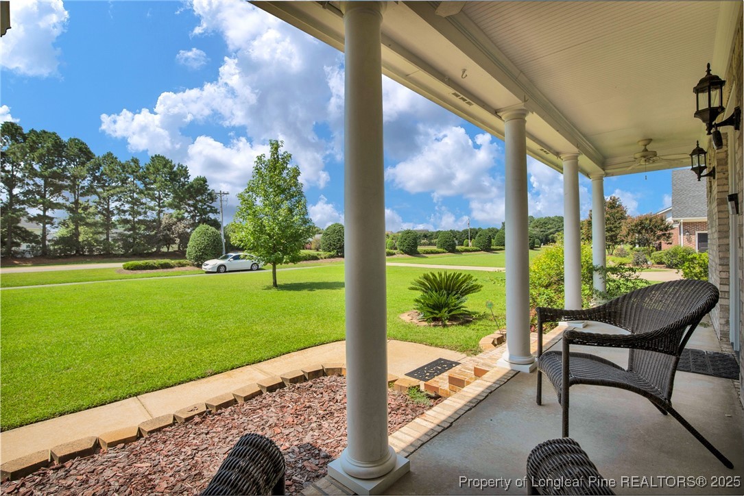 995 Adcox Road Raeford, NC 28376 - Photo 9 of 50 a view of a porch with furniture and garden